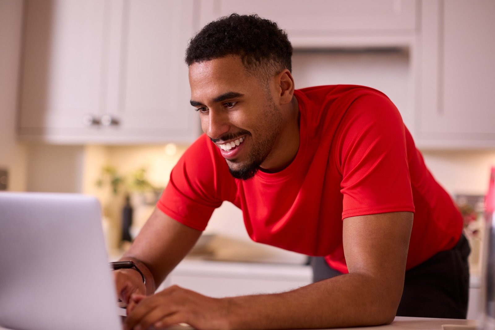 man-in-kitchen-at-home-wearing-fitness-clothing-wo-5ANGT5P-scaled.jpg